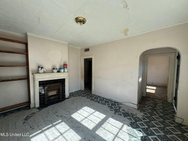 unfurnished living room featuring a tiled fireplace