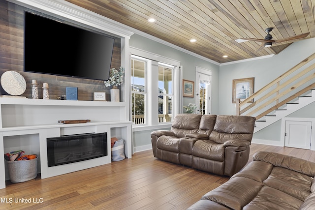 living room featuring wood finished floors, wood ceiling, and ornamental molding