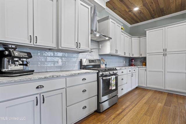 kitchen featuring stainless steel gas range oven, ornamental molding, tasteful backsplash, wall chimney range hood, and wood ceiling