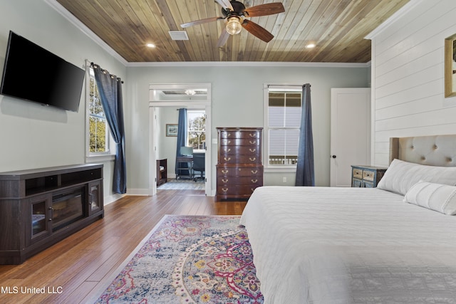 bedroom featuring wooden ceiling, wood-type flooring, and ornamental molding