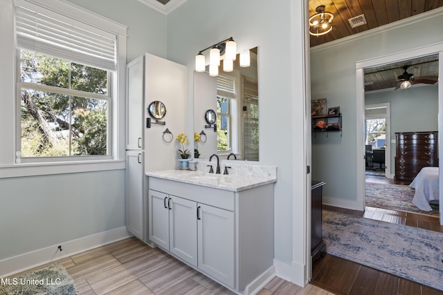 full bathroom featuring crown molding, wood finished floors, baseboards, and visible vents