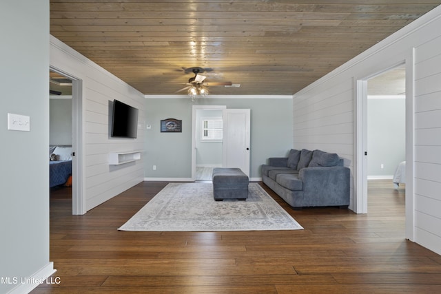 living area featuring a ceiling fan, dark wood-style floors, crown molding, baseboards, and wood ceiling