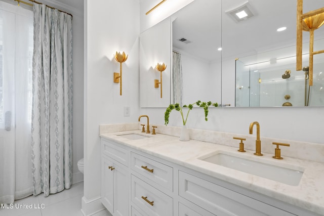 full bathroom with crown molding, visible vents, a sink, and a shower stall