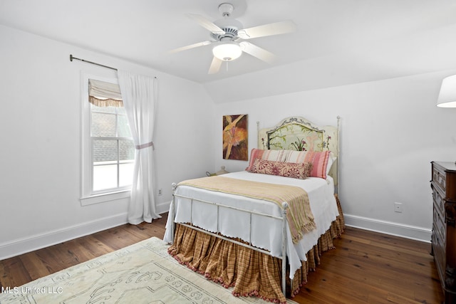 bedroom featuring vaulted ceiling, ceiling fan, dark wood-style floors, and baseboards