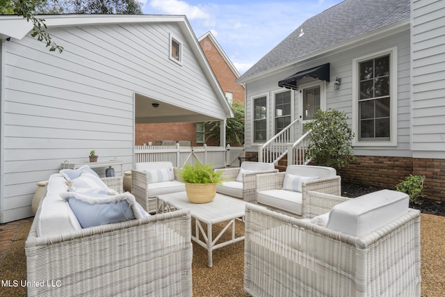 view of patio / terrace with outdoor lounge area and fence