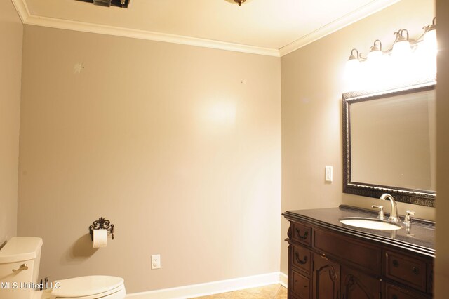 1639 Pascagoula River Rd, Moss Point, MS 39562 - bathroom featuring toilet, ornamental molding, baseboards, and vanity