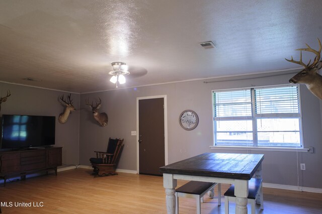 1639 Pascagoula River Rd, Moss Point, MS 39562 - dining room with light wood-style floors, ceiling fan, baseboards, and ornamental molding