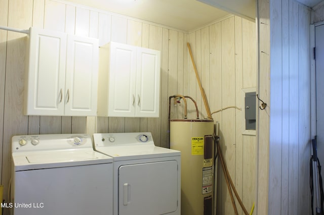 1639 Pascagoula River Rd, Moss Point, MS 39562 - washroom with electric water heater, cabinet space, independent washer and dryer, and wooden walls