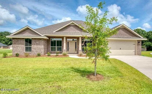 craftsman inspired home with a front yard and a garage