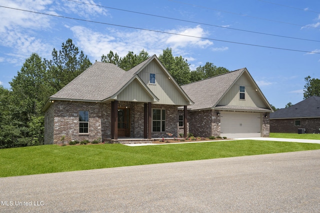 view of front of house featuring concrete driveway, brick siding, a porch, and a front lawn