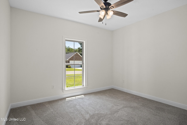 carpeted spare room with baseboards, plenty of natural light, and visible vents