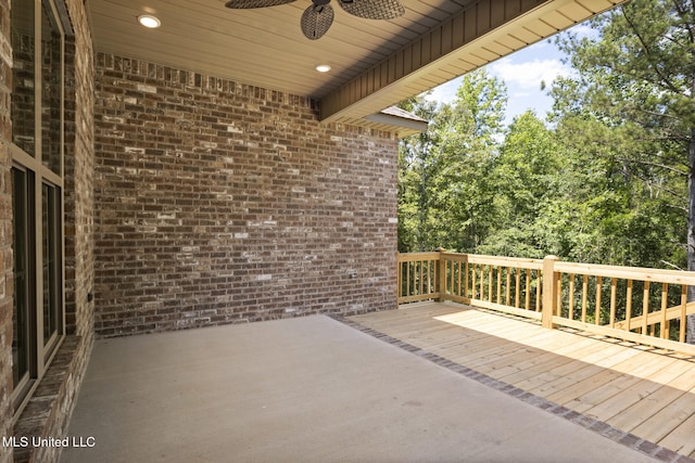 deck with a ceiling fan and a patio