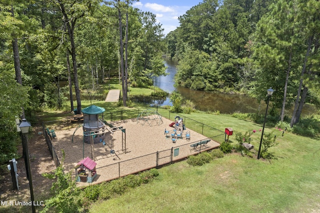 view of yard featuring fence and a water view