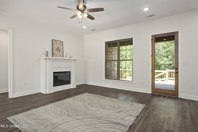 living room with ceiling fan, visible vents, dark wood-style floors, and ornamental molding