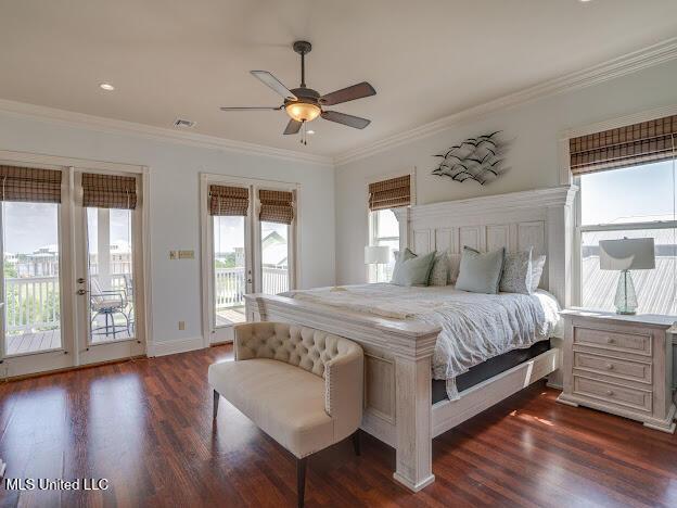 bedroom with access to exterior, dark wood finished floors, and ornamental molding