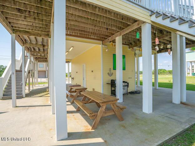 view of patio with stairway