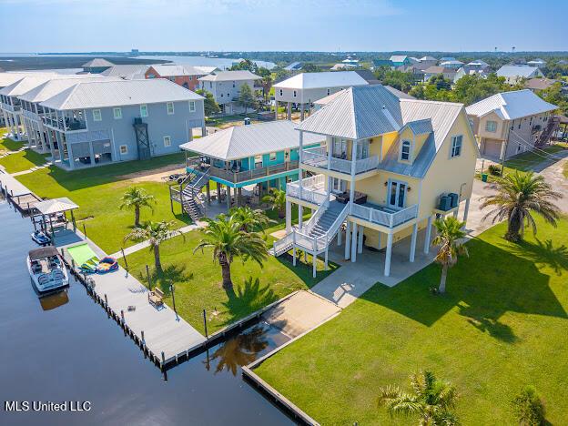 birds eye view of property with a residential view and a water view