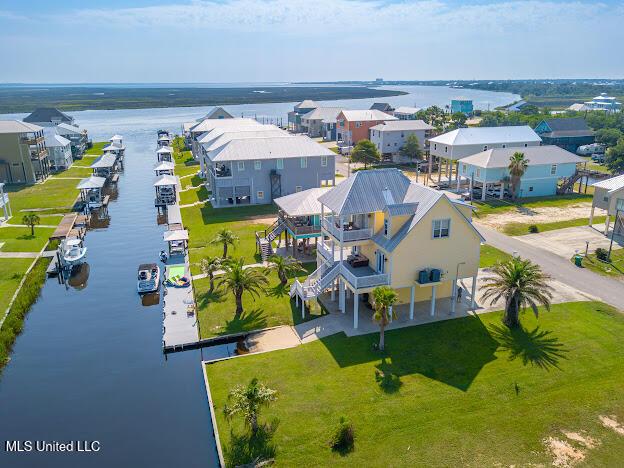 bird's eye view featuring a residential view and a water view