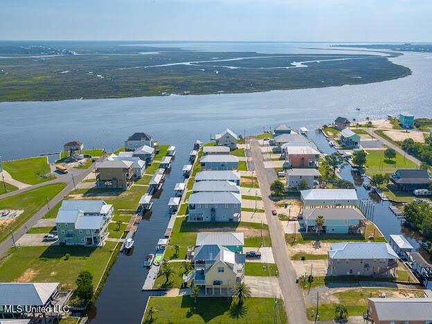 birds eye view of property featuring a residential view and a water view