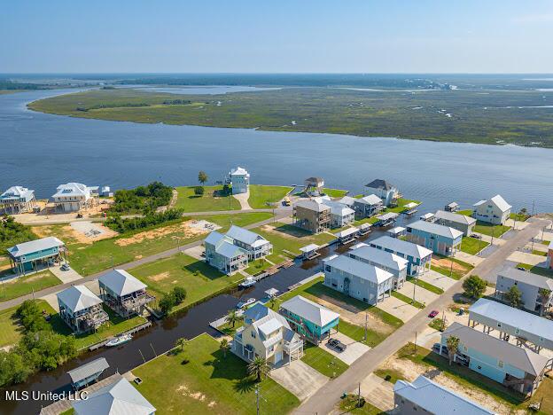 birds eye view of property featuring a residential view and a water view