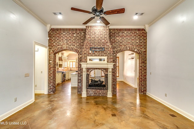 128 Amethyst Ln, Brandon, MS 39047 - unfurnished living room featuring ceiling fan, arched walkways, a brick fireplace, crown molding, and brick wall