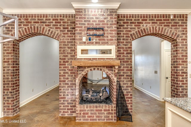 128 Amethyst Ln, Brandon, MS 39047 - unfurnished living room featuring baseboards, tile patterned flooring, crown molding, and arched walkways