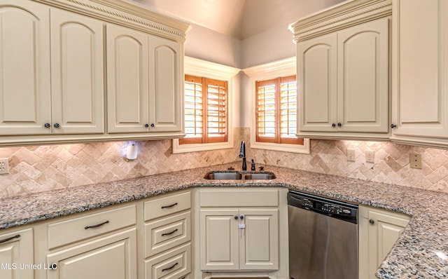 128 Amethyst Ln, Brandon, MS 39047 - kitchen with stainless steel dishwasher, cream cabinetry, a sink, and backsplash