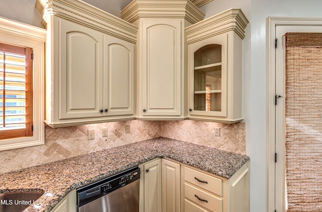 128 Amethyst Ln, Brandon, MS 39047 - kitchen with cream cabinetry, dishwasher, backsplash, and light stone counters