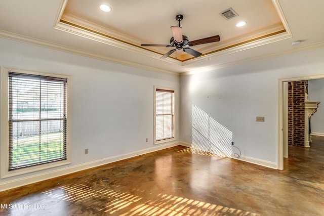 128 Amethyst Ln, Brandon, MS 39047 - empty room with a tray ceiling, crown molding, baseboards, finished concrete floors, and a ceiling fan