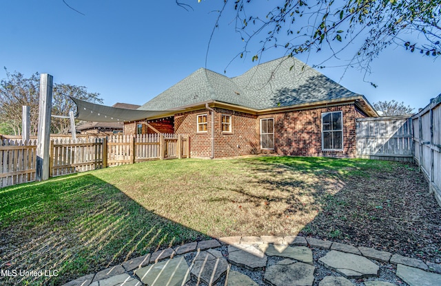 128 Amethyst Ln, Brandon, MS 39047 - rear view of house with roof with shingles and brick siding