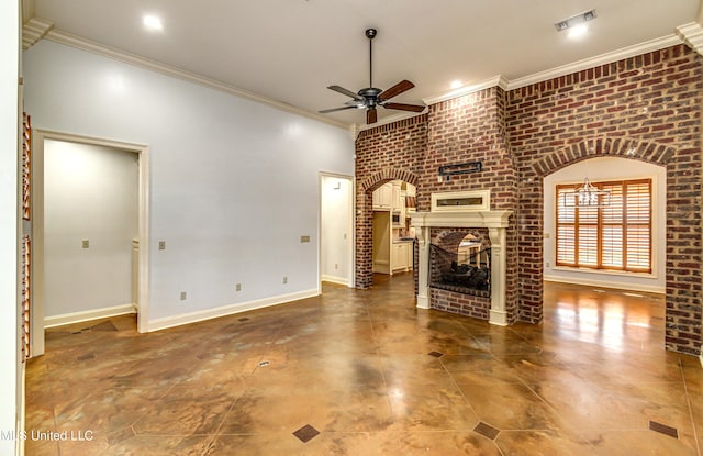 128 Amethyst Ln, Brandon, MS 39047 - unfurnished living room with a ceiling fan, crown molding, a fireplace, brick wall, and baseboards