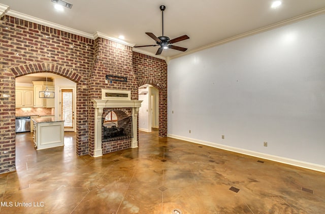 128 Amethyst Ln, Brandon, MS 39047 - unfurnished living room with arched walkways, ceiling fan, crown molding, a fireplace, and brick wall