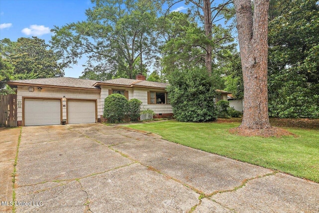 1032 Meadowbrook Rd, Jackson, MS 39206 - view of front of home featuring a garage, concrete driveway, a front lawn, a chimney, and crawl space