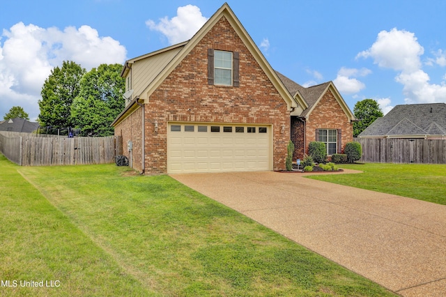 4813 Rosepetal Cv, Southaven, MS 38672 - traditional-style house with a front yard, a garage, brick siding, fence, and concrete driveway