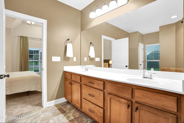 4813 Rosepetal Cv, Southaven, MS 38672 - ensuite bathroom with double vanity, a sink, baseboards, and ensuite bathroom