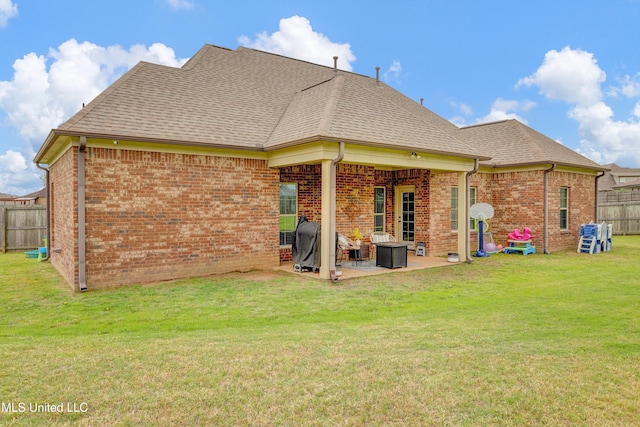 4813 Rosepetal Cv, Southaven, MS 38672 - rear view of house featuring a lawn, brick siding, fence, and a patio area