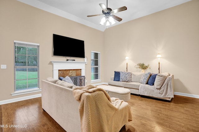 4813 Rosepetal Cv, Southaven, MS 38672 - living area featuring a ceiling fan, baseboards, wood finished floors, and a fireplace