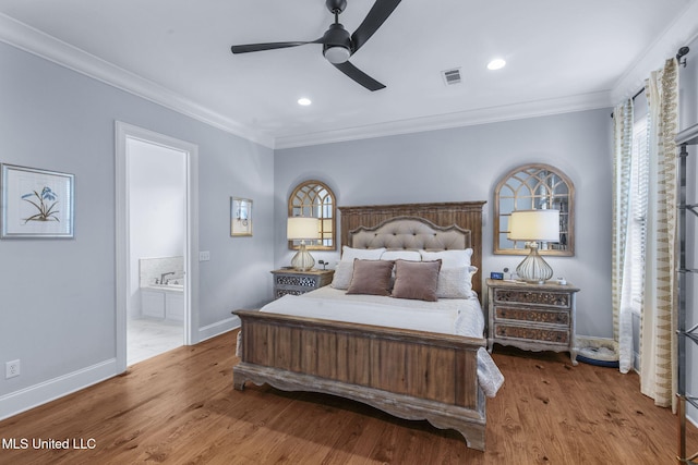 bedroom with crown molding, baseboards, multiple windows, and visible vents