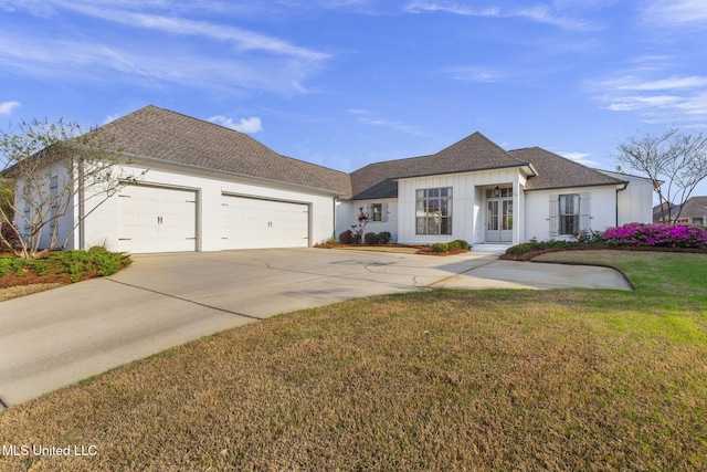 ranch-style home with concrete driveway, a shingled roof, a front lawn, and a garage
