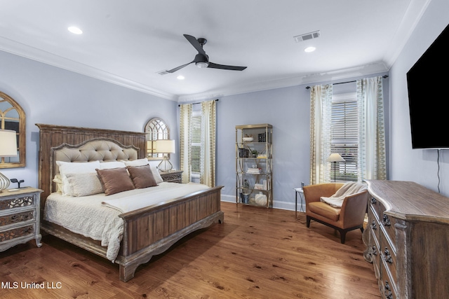 bedroom featuring baseboards, ornamental molding, recessed lighting, and wood finished floors