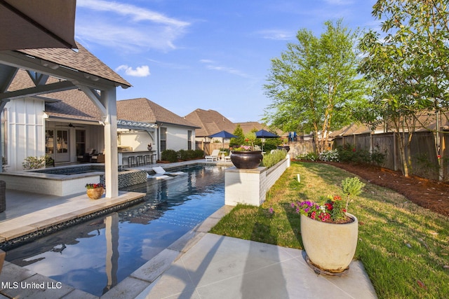 view of pool with a fenced in pool, a fenced backyard, ceiling fan, and a patio area