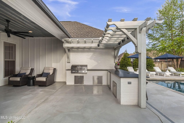 view of patio featuring fence, an outdoor kitchen, a fenced in pool, a ceiling fan, and a grill