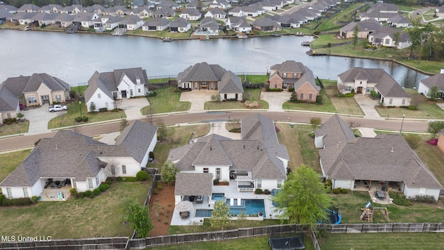 aerial view with a residential view and a water view
