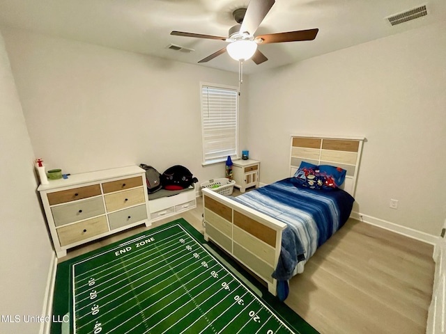 bedroom featuring ceiling fan and wood-type flooring