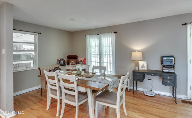 dining room with light hardwood / wood-style flooring