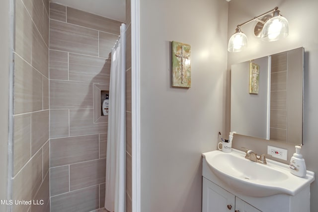 bathroom with vanity and a shower with shower curtain