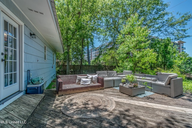 wooden terrace with an outdoor hangout area