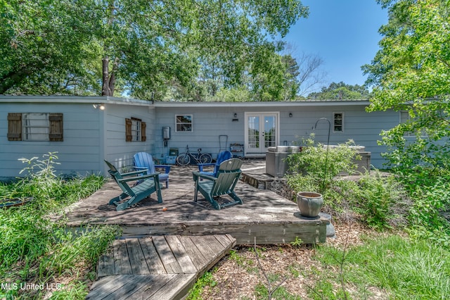 back of property with french doors and a deck