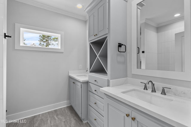 full bathroom with baseboards, ornamental molding, a sink, two vanities, and recessed lighting