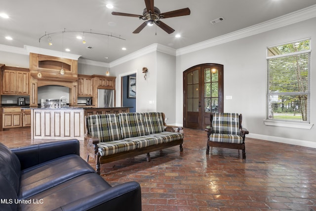 1400 Magnolia Bluff Dr, Gautier, MS 39553 - living room featuring baseboards, healthy amount of natural light, arched walkways, and crown molding